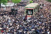Tens of thousands gather for Raisi funeral procession in Tehran